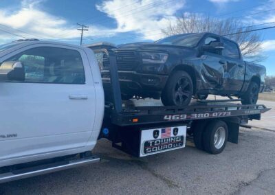 Accident Recovery Flatbed Towing Ram Black SUV