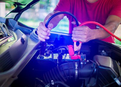 Man Doing Battery Jump Start