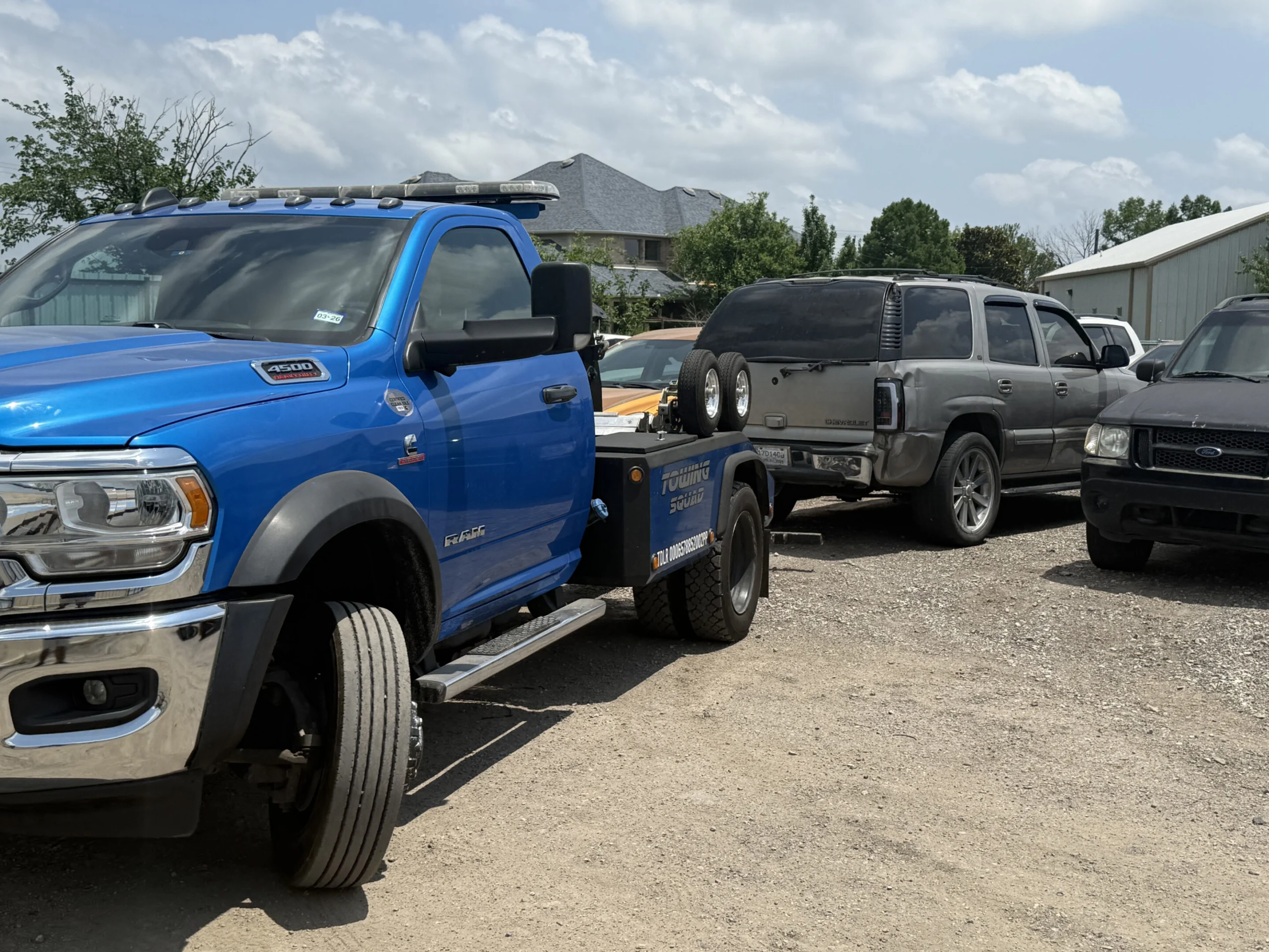 Front of the blue Towing Squad Ram tow truck