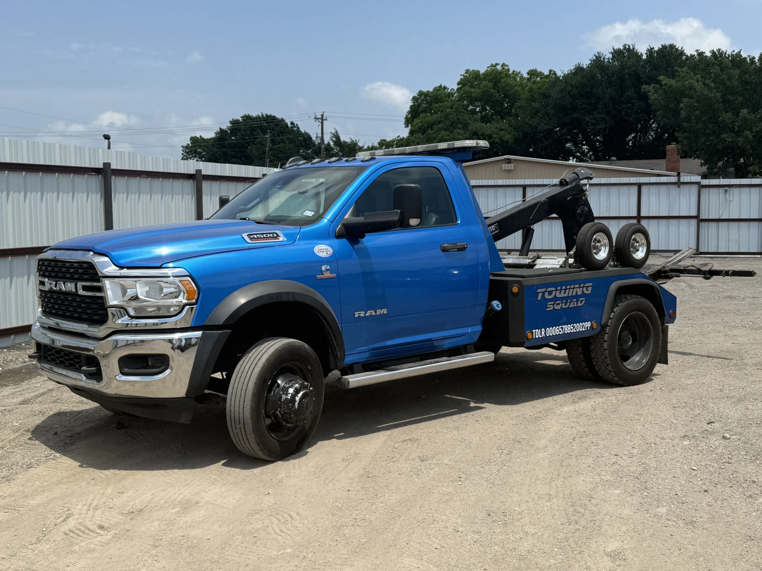Blue Towing Squad Ram wrecker tow truck parked in the lot